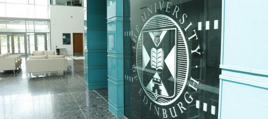 University crest on a glass door