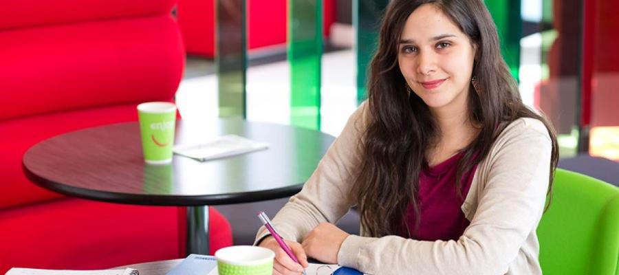 Woman writing in a notepad