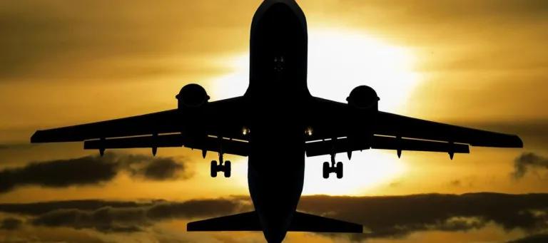sillouette of an airplane against a sunset