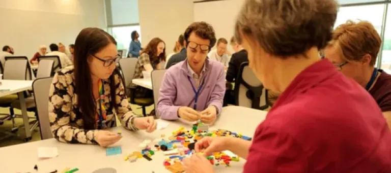 Image of conference attendees in an interactive sessions