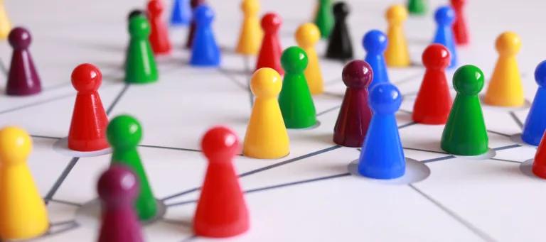 Image of plastic figures linked by string
